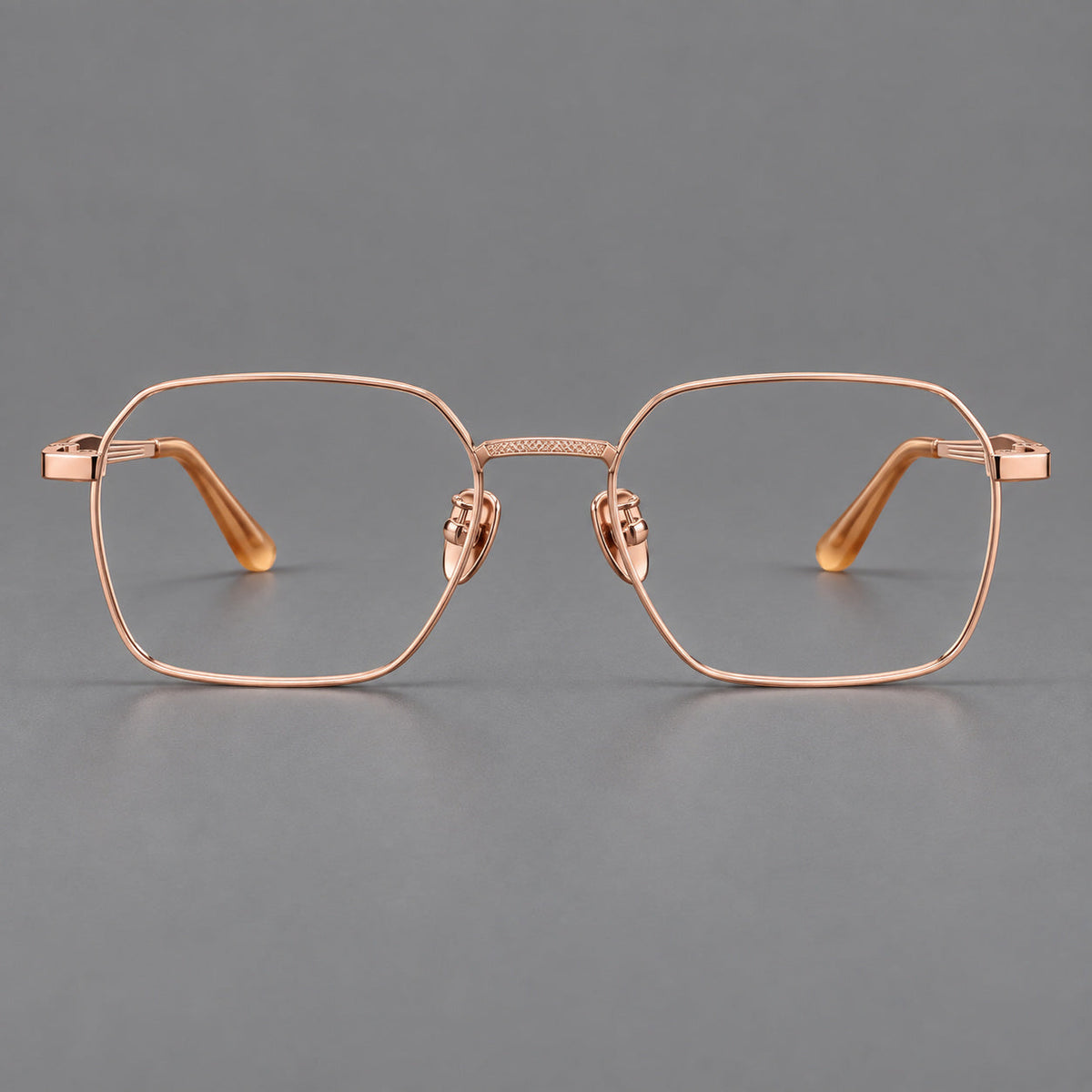 Geometric square titanium glasses with a textured bridge and fine temple grooves in Rose Gold, front view