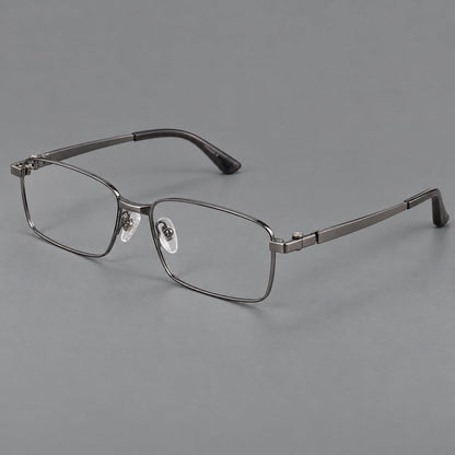 Wide rectangular titanium glasses with a broad bridge and rounded hinge caps in Gunmetal, three quarter view front view