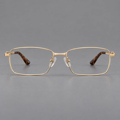 Wide rectangular titanium glasses with a broad bridge and rounded hinge caps in Gold, front view temple detail