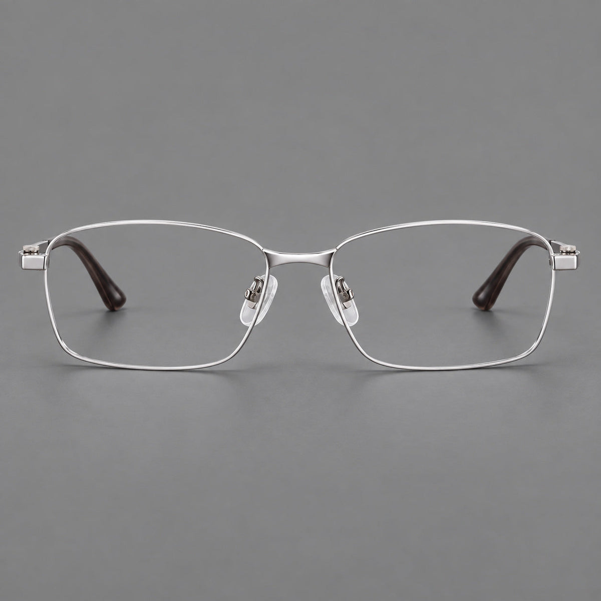 Wide rectangular titanium glasses with a broad bridge and rounded hinge caps in Silver, front view