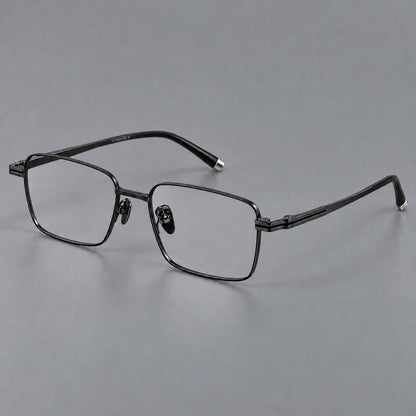 Rectangular titanium glasses with inset corner lines and metal capped temple tips in Black, three quarter view