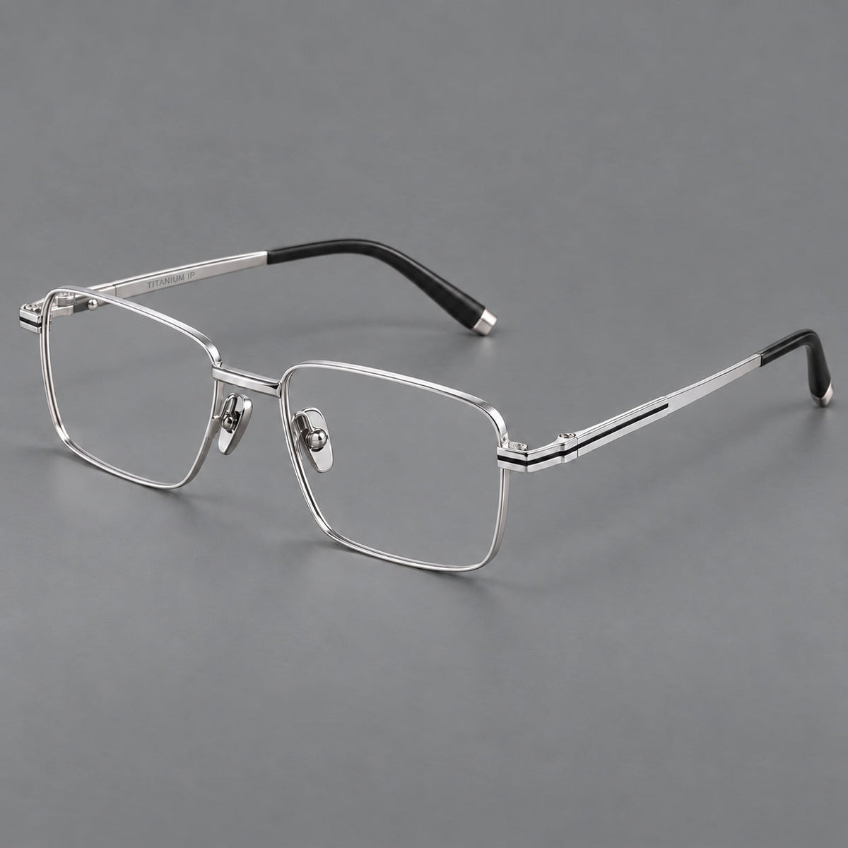 Rectangular titanium glasses with inset corner lines and metal capped temple tips in Silver, three quarter view