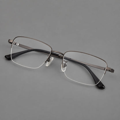 Half frame titanium glasses with rectangular lenses and rounded hinge details in Gunmetal, three quarter view front view