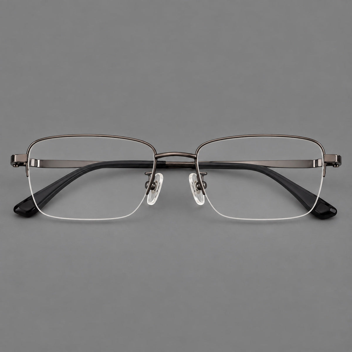 Half frame titanium glasses with rectangular lenses and rounded hinge details in Gunmetal, front view