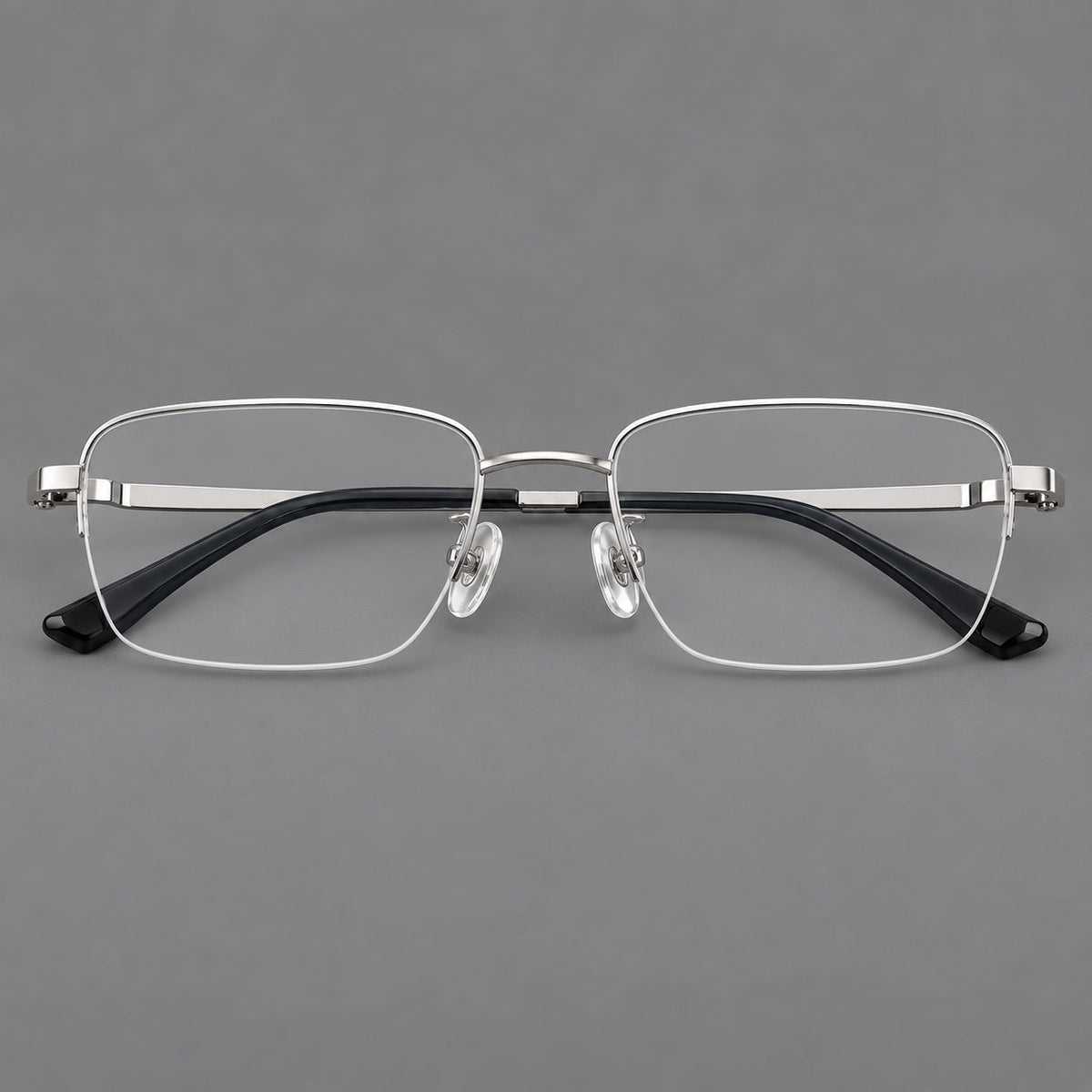 Half frame titanium glasses with rectangular lenses and rounded hinge details in Silver, front view