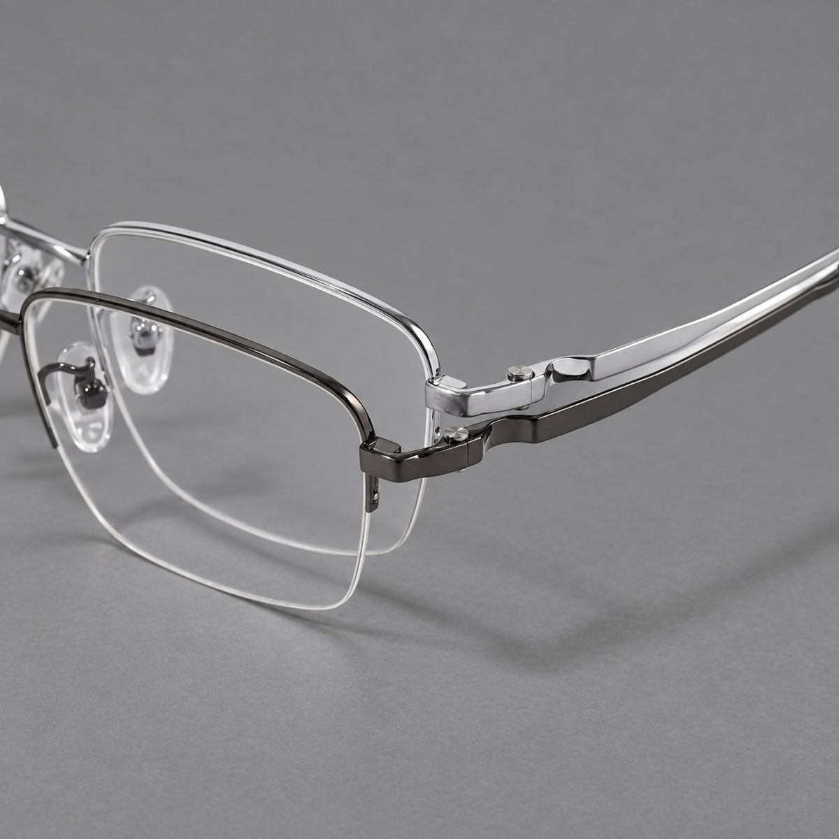 Half frame titanium glasses with rectangular lenses and rounded hinge details, frame details