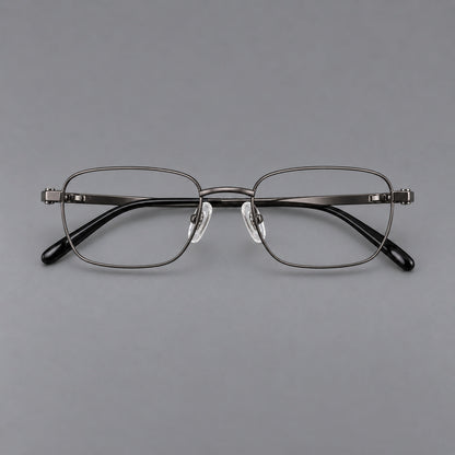 Shallow rectangular titanium glasses with a broad bridge and stepped temple joins in Gunmetal, front view frame detail