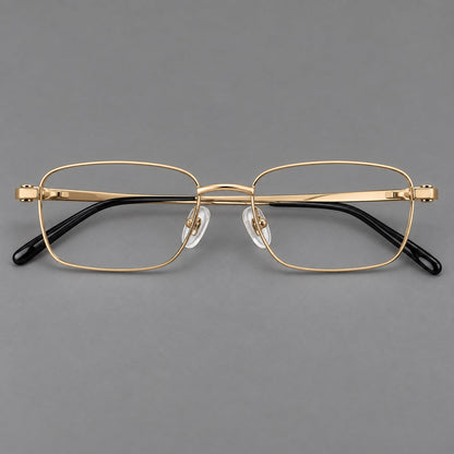 Shallow rectangular titanium glasses with a broad bridge and stepped temple joins in Gold, front view temple detail