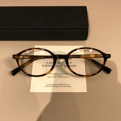 Wide Oval Eyeglass Frames | Tortoiseshell frame detail