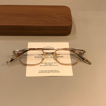 Rounded Rectangle Wire-Style Frames | Gold Tone frame detail